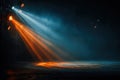 Orange and blue spotlights illuminate the empty, smoke-filled stage. Royalty Free Stock Photo
