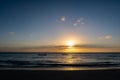 Orange and blue sunset over the Indian Ocean, with small silhouettes of fishing boats on the horizon, Pemba Island, Tanzania Royalty Free Stock Photo