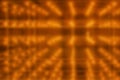 Orange blurred fantastic background with perspective, light bulbs diodes, cosmic glow, computer design, modern trend