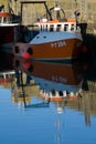 Orange boat and blue sky reflection Royalty Free Stock Photo