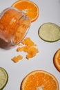 Orange body scrub spilled on a white background. Royalty Free Stock Photo