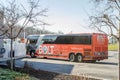 Orange Bolt Bus Parked in a Rest Area of a Highway Outside Washington DC, USA