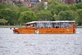 Orange Boston Duck Tours D.U.K.W Amphibian Vehicle, Olga Ironsides, on The Charles River.