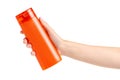 Orange bottle beauty shampoo shower gel in hand Royalty Free Stock Photo