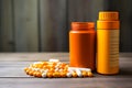 Orange bottles with pills on wooden background Royalty Free Stock Photo