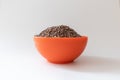 Orange bowl full of lentils, non perish food, white background