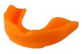 Orange boxing mouthguard, on white background, teeth protection