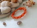 Orange bracelet and sea stones