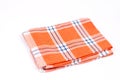 Orange brand new kitchen dishtowel over white background Royalty Free Stock Photo