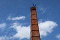 Orange brick smokestack crematorium crematorium in Thai temple, normal sky background, can be called funeral concept. Royalty Free Stock Photo