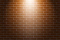 Orange brick wall texture background with light of spotlight Royalty Free Stock Photo