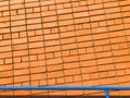 Orange brick wall. Textured background with copy space for design work. Material pattern. Reddish-brown brick blocks Royalty Free Stock Photo