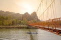 Orange bridge over song river in Vang Vieng,Laos Royalty Free Stock Photo