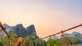 Orange bridge over song river in Vang Vieng,Laos Royalty Free Stock Photo