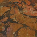 Orange brown and gold marbled paper texture