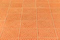 Orange brown paving slabs floor abstract pattern city street surface stone texture background tile mosaic Royalty Free Stock Photo