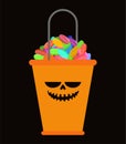 Orange Bucket candy for Halloween isolated. Traditional sweets f