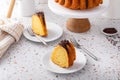 Orange bundt cake topped with chocolate ganache cut into slices Royalty Free Stock Photo