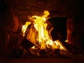 Orange burning wood in a stone oven inside, fire in the fireplace Royalty Free Stock Photo