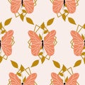 Orange butterflies and leaves in a seamless pattern design Royalty Free Stock Photo