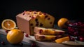 Orange cake with cranberries and oranges on a wooden board on a black background