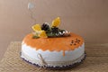 Orange cake with decoration on it