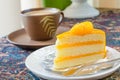 Orange cake and late coffee cup Royalty Free Stock Photo