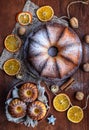 Orange cake ,nuts on brown background