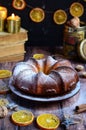 Orange cake ,nuts on brown background