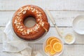 Orange cake served on a white wooden table view from above