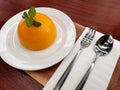 Orange cake with a spoon and fork on a white plate Royalty Free Stock Photo