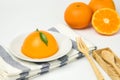 Orange cake on white background. environment have fresh oranges and spoons.