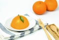 Orange cake on white background. environment have fresh oranges and spoons.