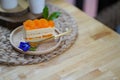 Orange cake on wood dish with butterfly pea flower Royalty Free Stock Photo