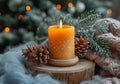 Orange candle on a carved wooden stand wrapped in a woolen blanket, with pinecones and fir branches, creating a cozy winter