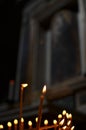 Orange Candle in Church dark background flame religion Royalty Free Stock Photo