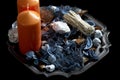 Orange candles with potpourri on an antique metal tray isolated