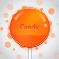 Orange candy on bright background. Lollipop Royalty Free Stock Photo