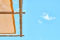 Orange canopy over sun loungers against clear blue sky Royalty Free Stock Photo