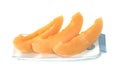 Orange cantaloupe melon fruit sliced on dish isolated on white background Royalty Free Stock Photo