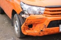 An orange car has an accident while traveling. Royalty Free Stock Photo
