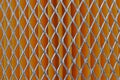 Orange car filter background with iron grille close-up Royalty Free Stock Photo