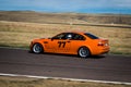 Orange car on race track