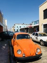 An orange car on the sunny streets of Mexico - MEXICO