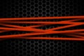 Orange carbon fiber frame on black mesh carbon background.