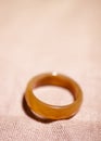 Orange carnelian stone ring on a blurry background