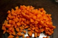 Orange carrots chopped up into small chucks for cooking a home cooked meal. Royalty Free Stock Photo