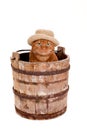 Orange Cat Wearing a Hat and Sitting in a Bucket Royalty Free Stock Photo