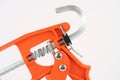 Orange Caulking Gun Royalty Free Stock Photo