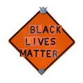 Orange caution sign reinvented to read BLACK LIVES MATTER